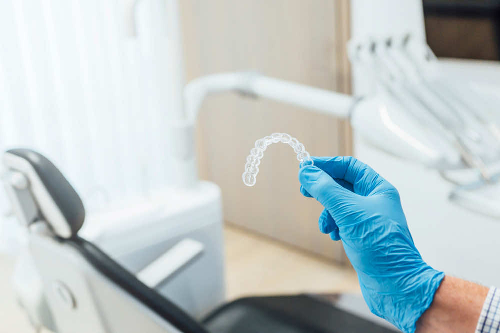 clear-aligner-hold-in-a-dental-office